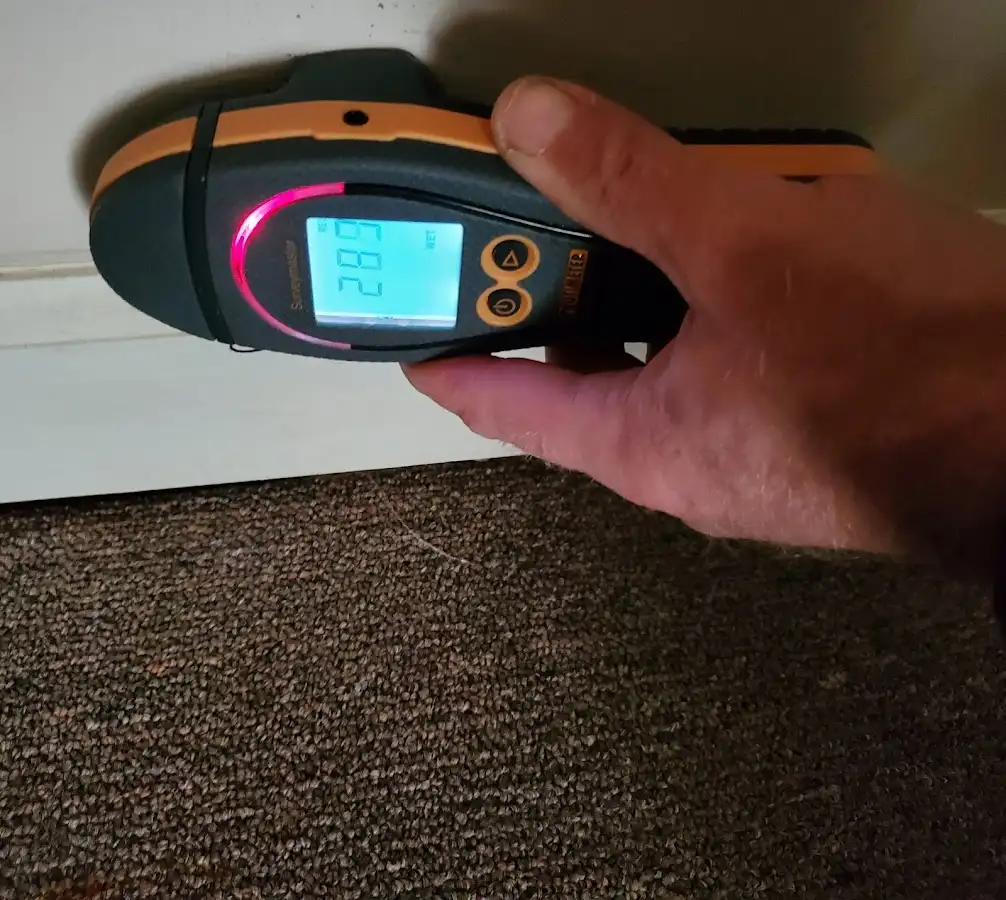 Moisture detection at baseboard during Storm Damage Restoration in Chester